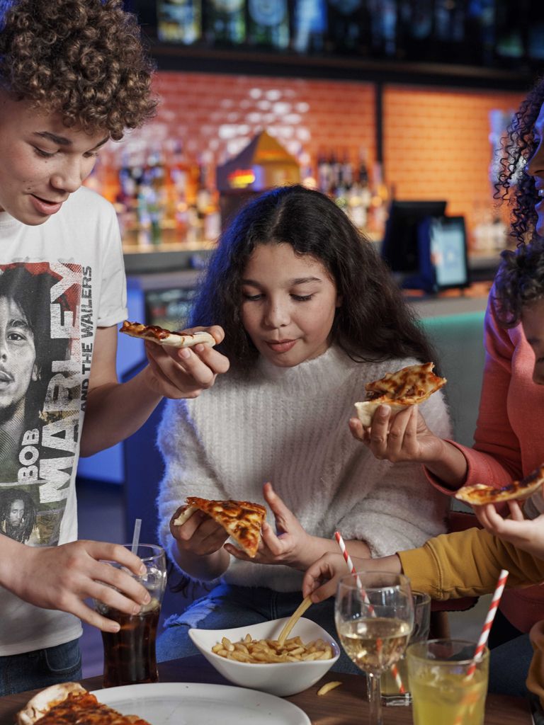 A family eating pizza